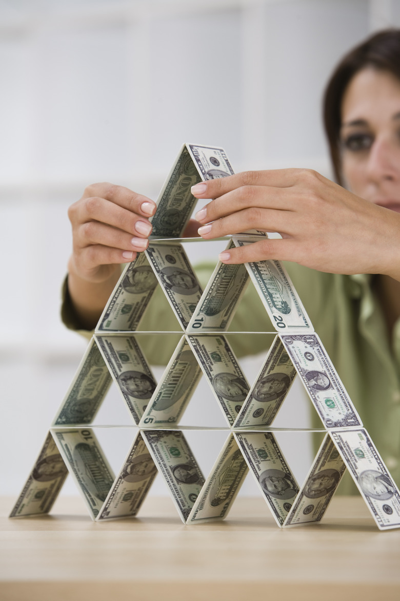 Woman stacking money