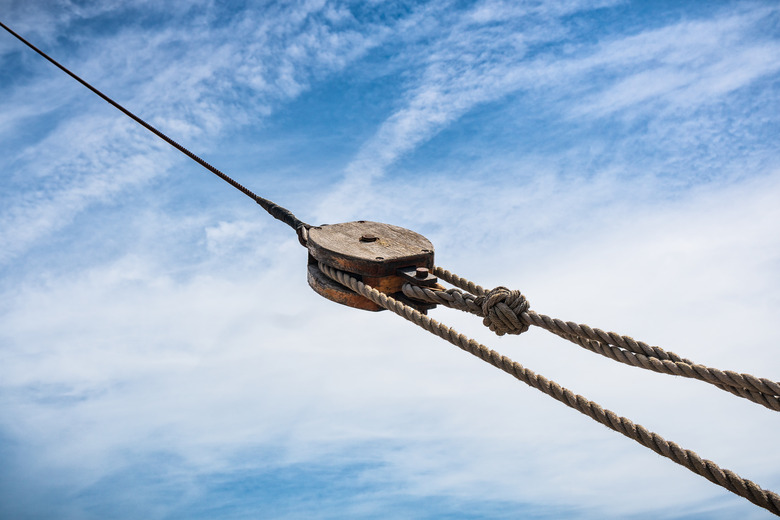 Wooden pulley on  old yacht.