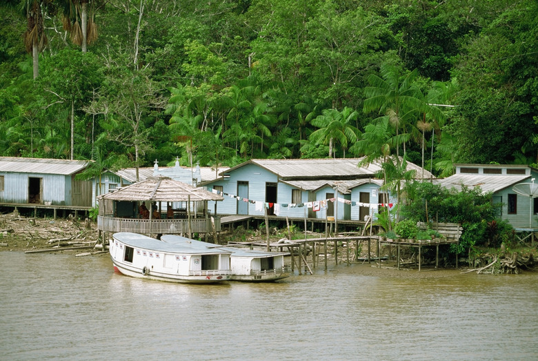 Boats and houses on Breves Narrows on the Amazon River, Brazil