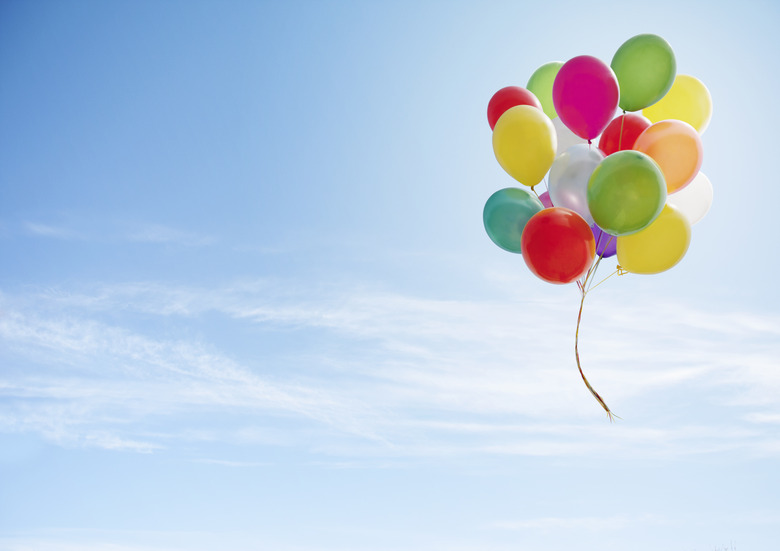 Colorful bunch of balloons floating in the sky