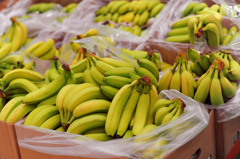 Ripe bananas on boxes in supermarket