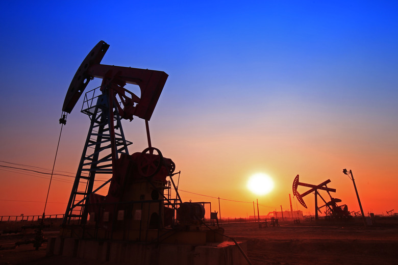 Sunset time of oil pump, oil industry equipment