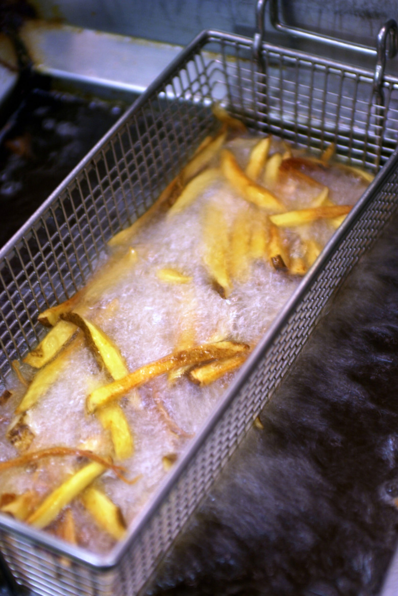 French fries cooking in deep fryer