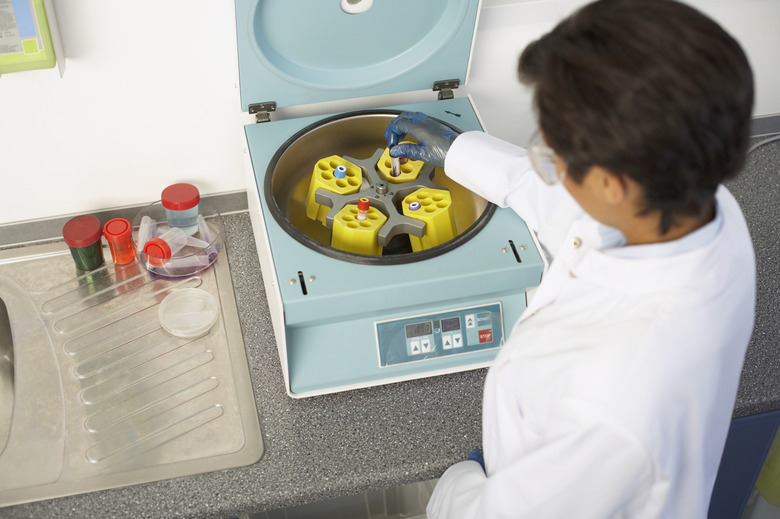 Scientist with centrifuge