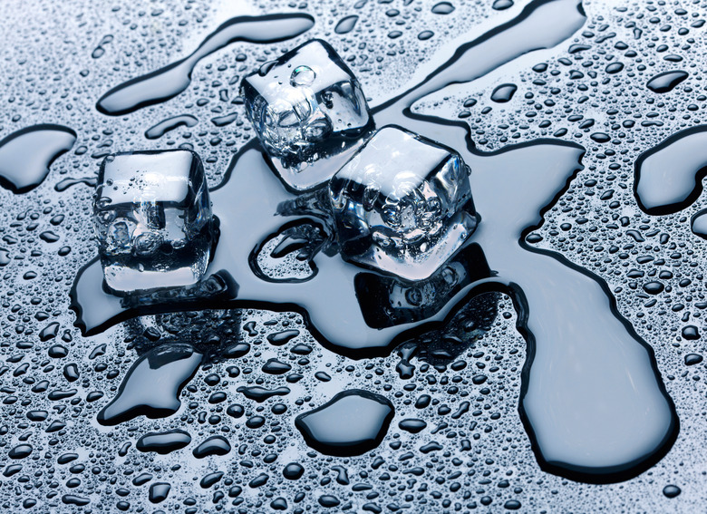 Ice cubes over dark background