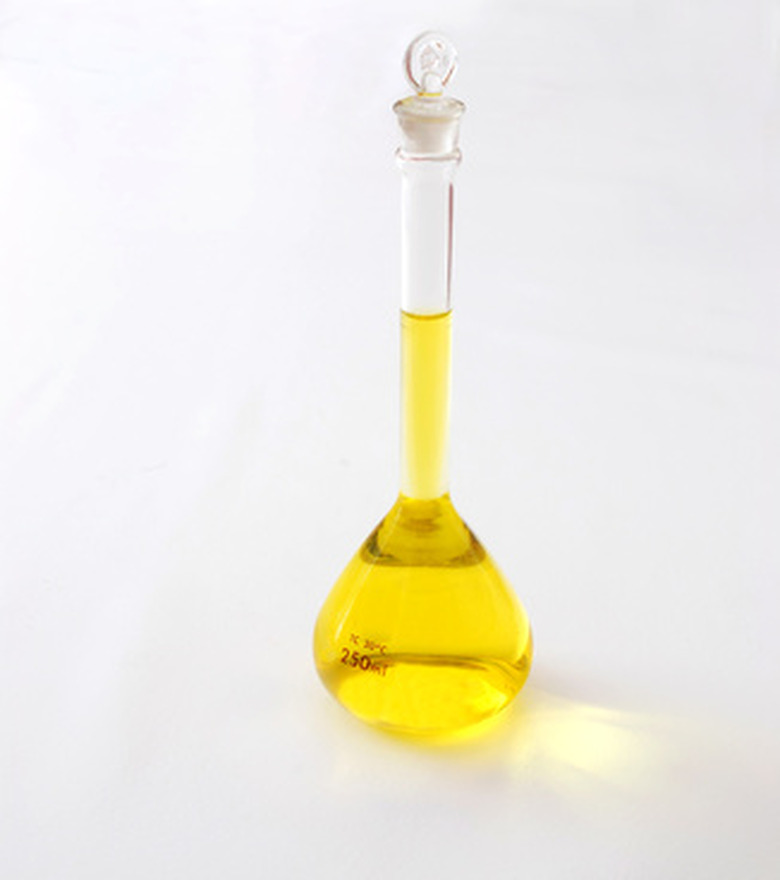 A yellow solution in a small glass flask with glass stopper