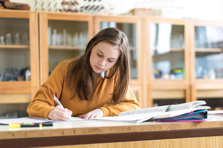 Girl working on papers in the classroom