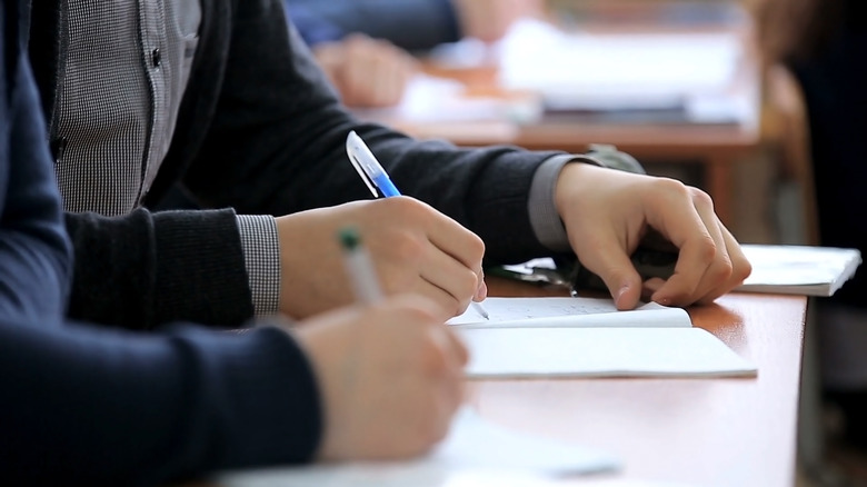 Group of people taking a test