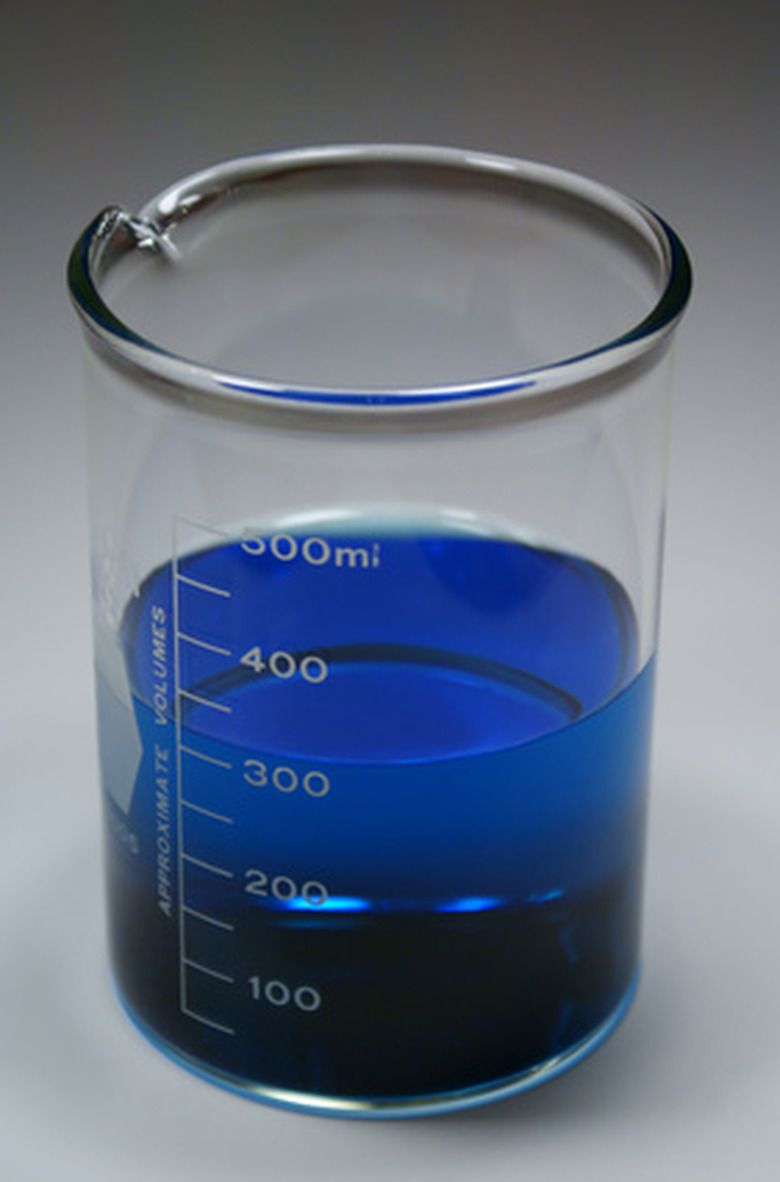 A beaker containing blue liquid