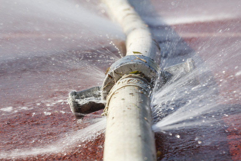 water leaking from hole in a hose