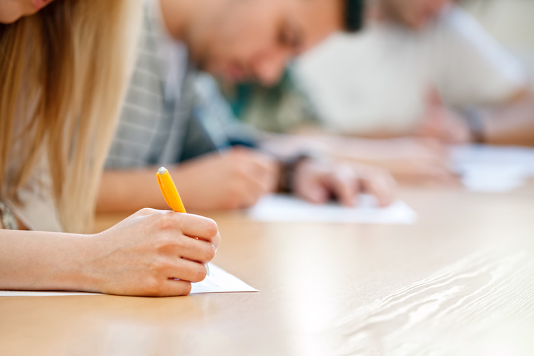 hand over paper making notes