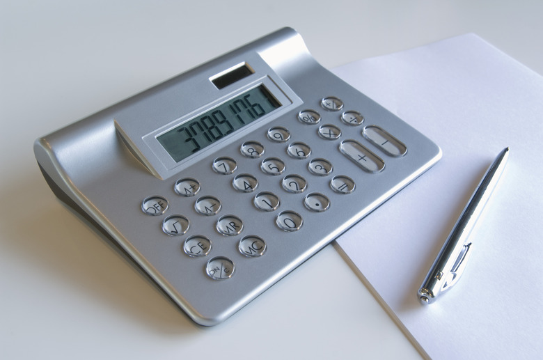 Calculator and pen on a table