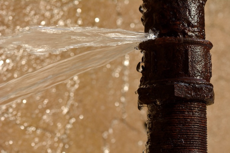 Rusty burst pipe in Baku Botanic Garden