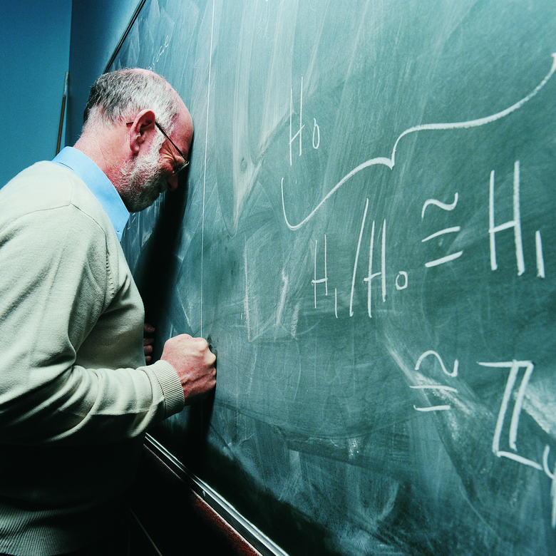 Portrait of a Frustrated Maths Lecturer Banging his Head Against a Blackboard