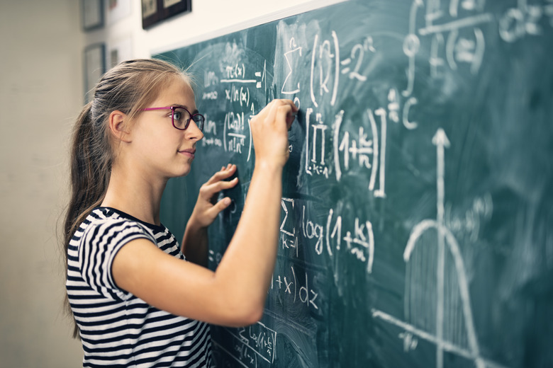 Teenage girl solving advanced mathematical problems