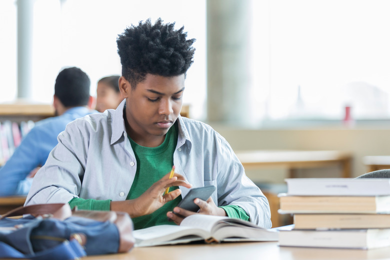 Teenage boy concentrates while studying