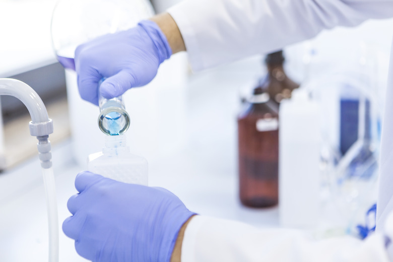 Senior male researcher carrying out scientific research in a lab