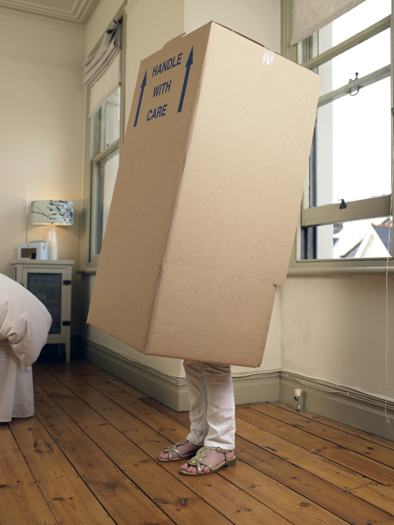 Woman in cardboard box