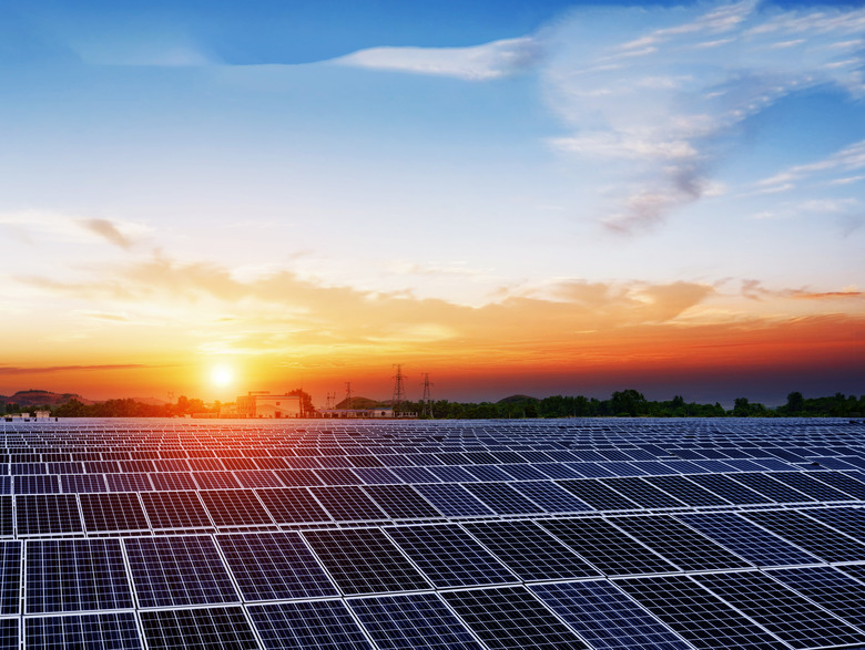 solar panels  under blue sky on sunset