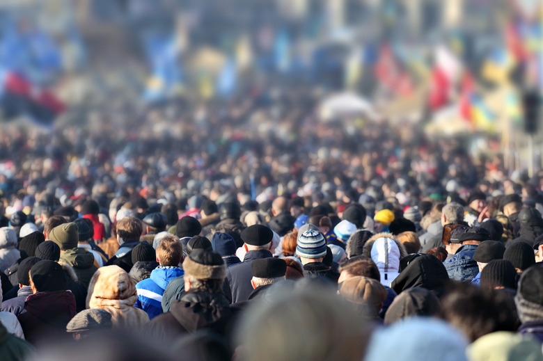 Crowd of anonymous people on street in city center