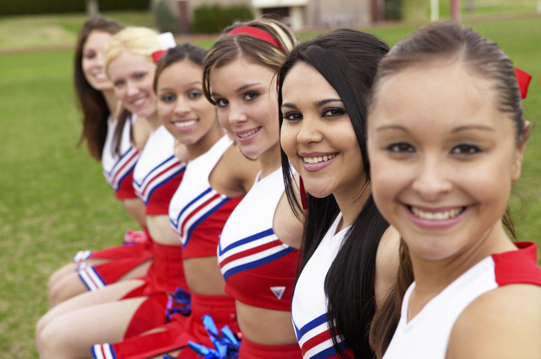 Group of Cheerleaders Sitting in a Line