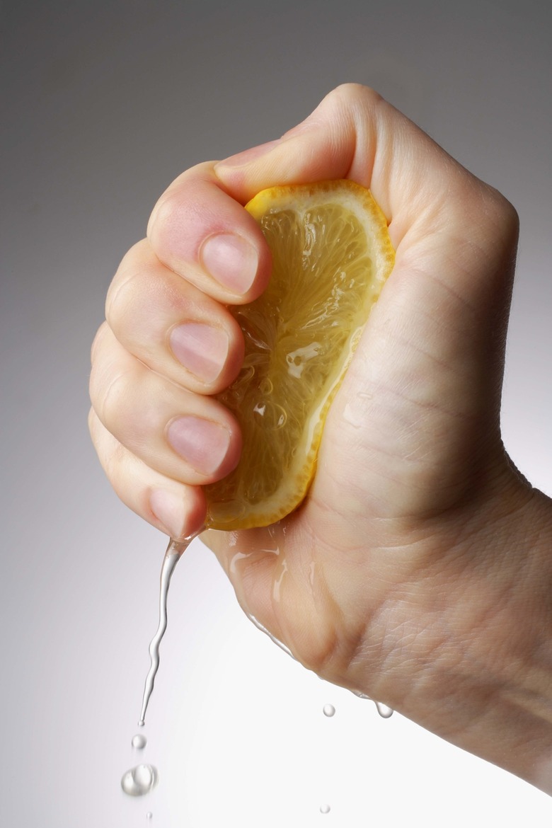 Hand squeezing lemon