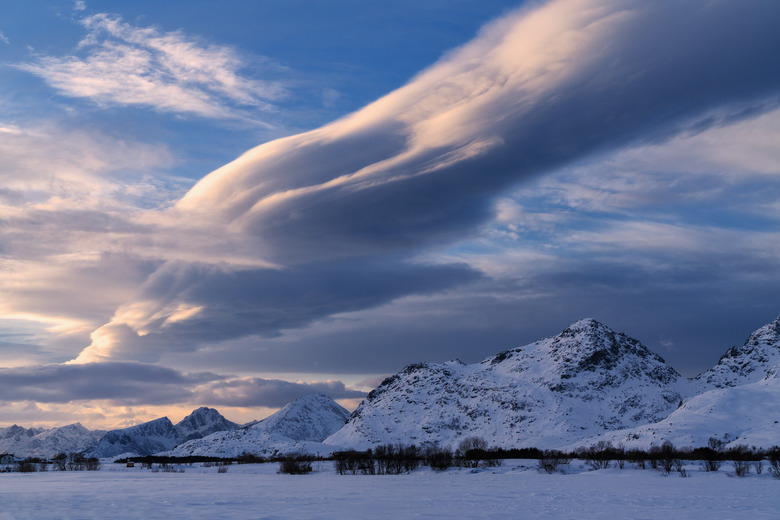 Clouds on snowy peaks, Leknes, Norway