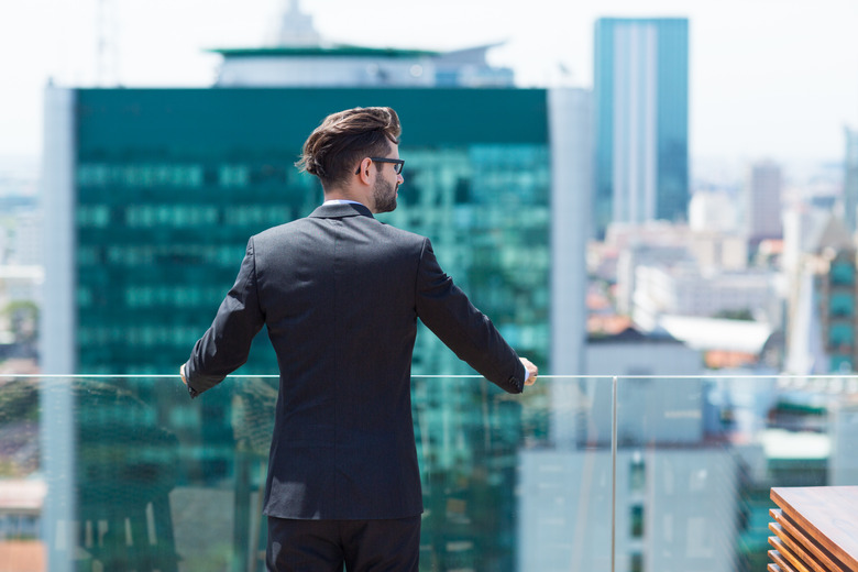 Young Businessman Looking at City