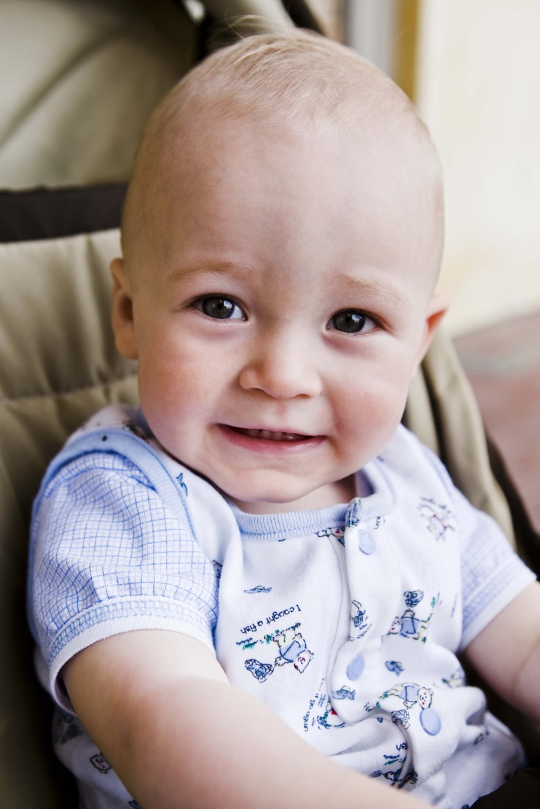 Baby boy sitting in stroller