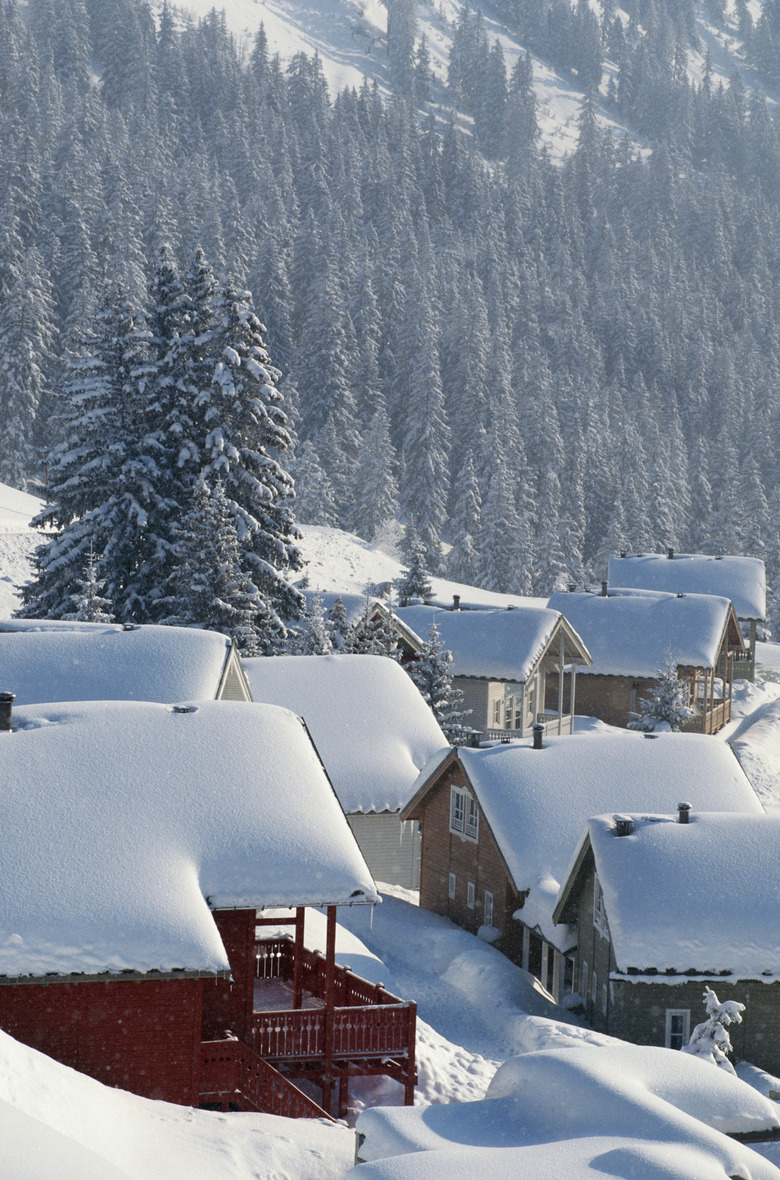 Log cabins covered with snow