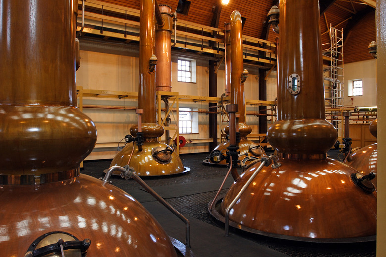 Stills in a whisky distillery