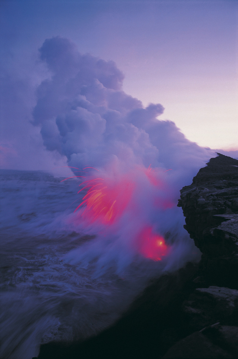 Steam rising as lava flow meets sea