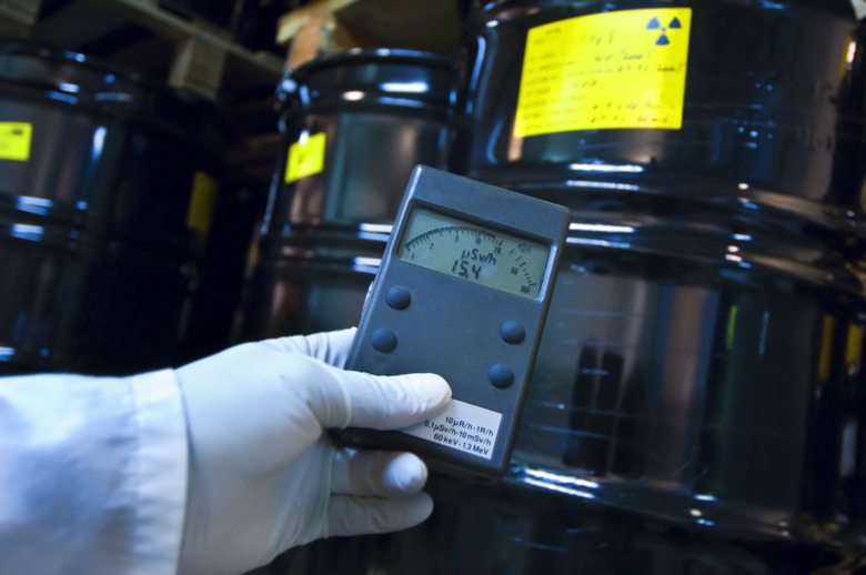 Man checking radiation with geiger counter