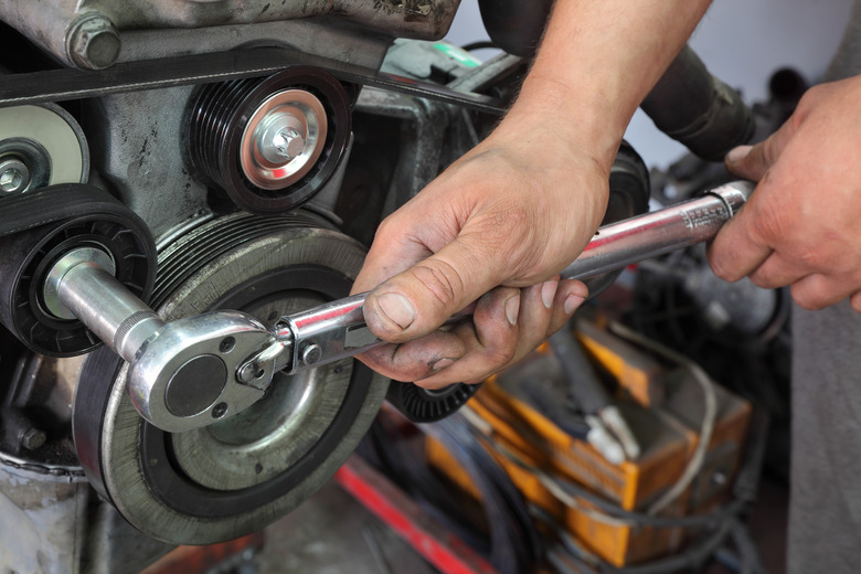 Modern car servicing pulley tightening