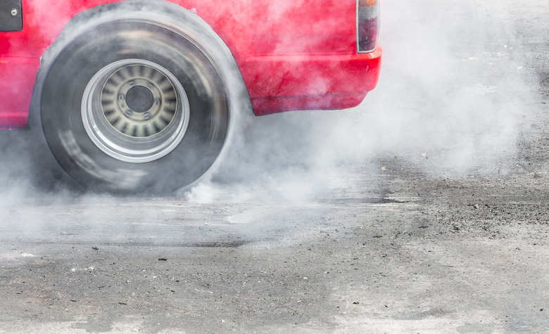 Drag racing car burns rubber