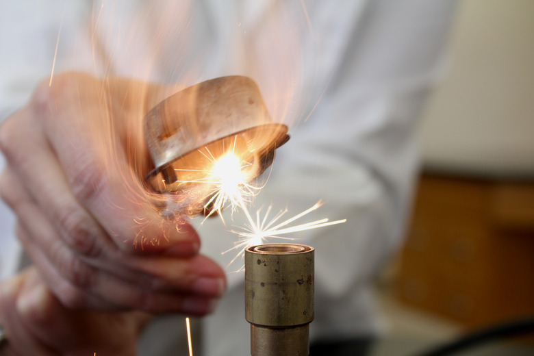 Biology teacher using Bunsen Burner