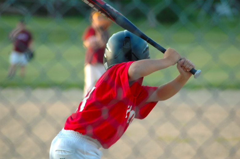 Boy up to bat in baseball game