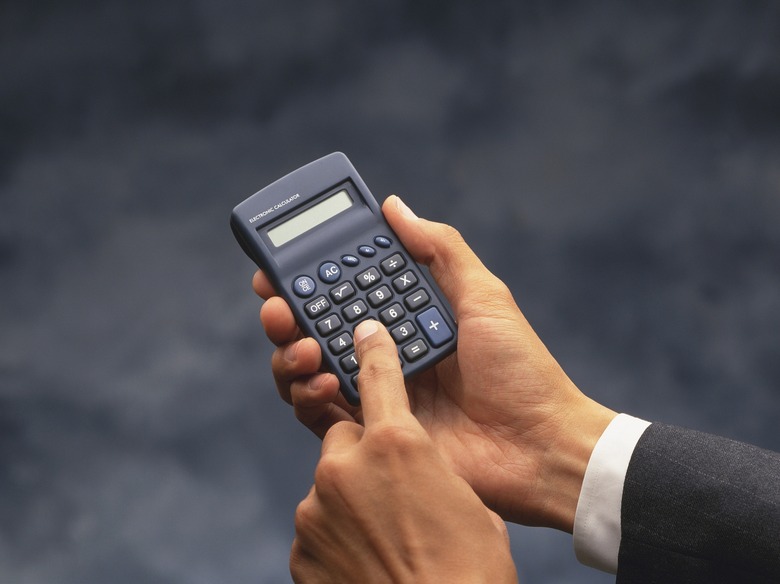 Photography of hands using a calculator, High Angle View