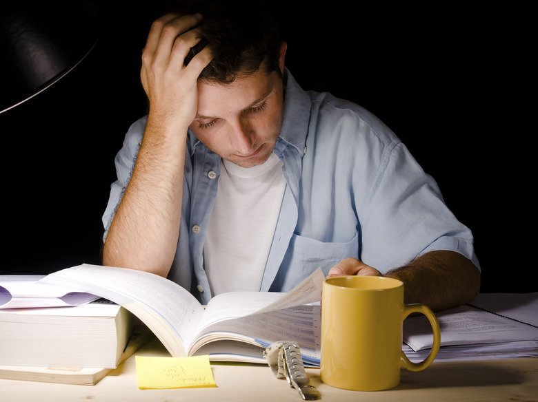 Young Man Studying at Night