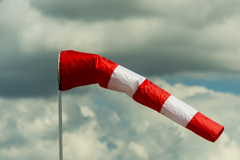 Airport windsock on the background of sky with thunderclouds