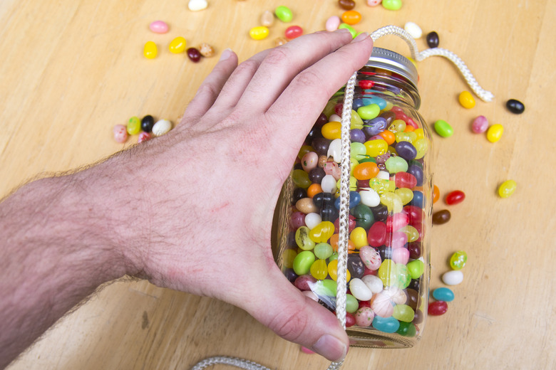 Vertical string on jelly bean jar.