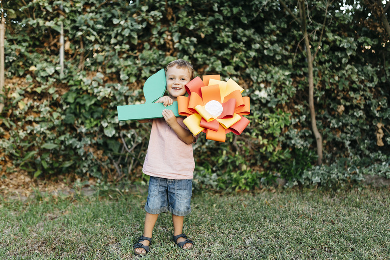 boy with large paper flower