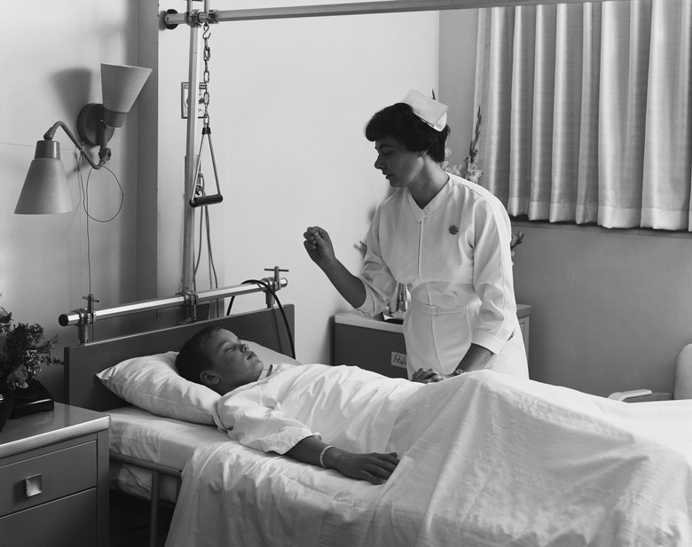 Female nurse checking boy's temperature