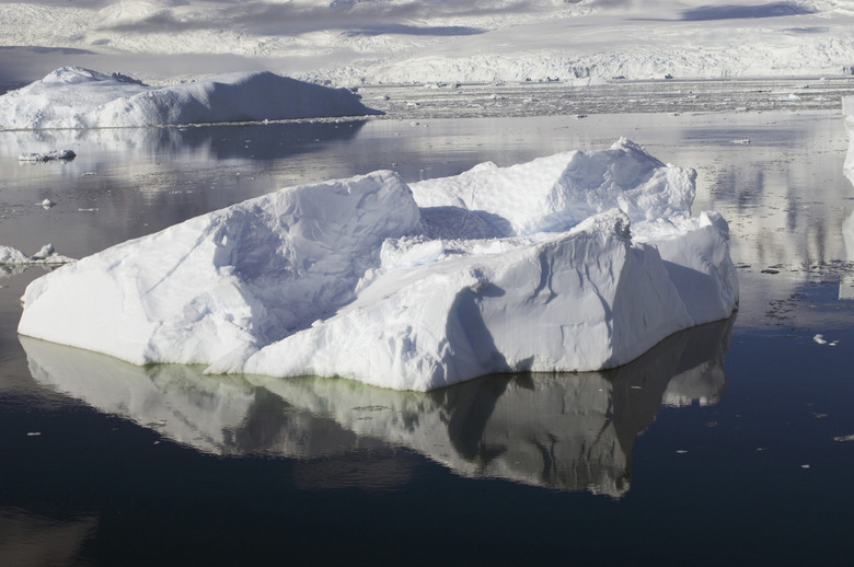 Reflection of icebergs in water