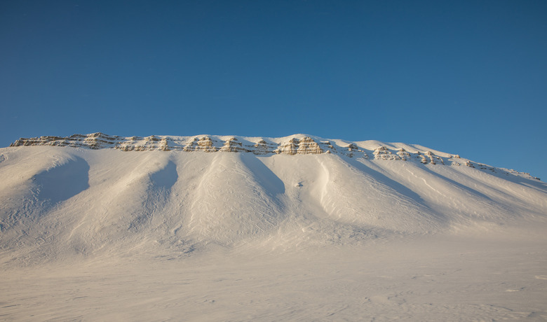 Beautiful arctic winter landscape with snow covered mountains on Svalbard, Norway