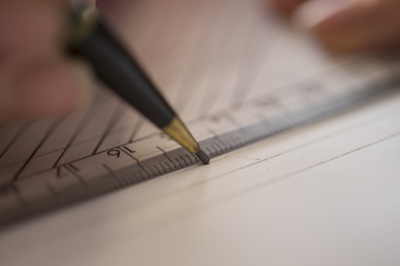 Close Up of Pencil Tracing a Line with a Ruler