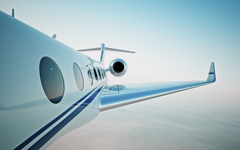 Closeup of realistic photo white, luxury generic design private jet