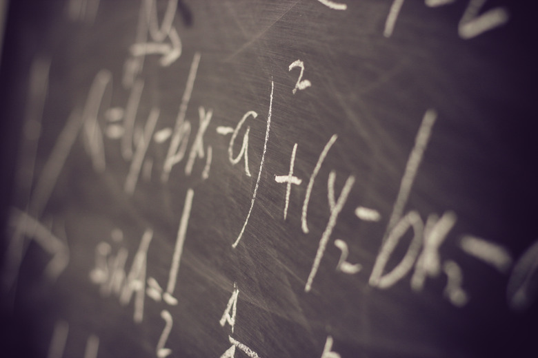 Maths formulas on chalkboard background