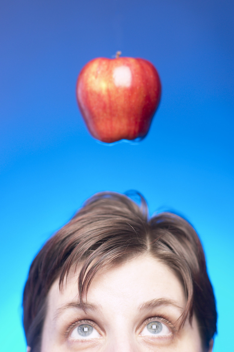 Man with apple falling toward head