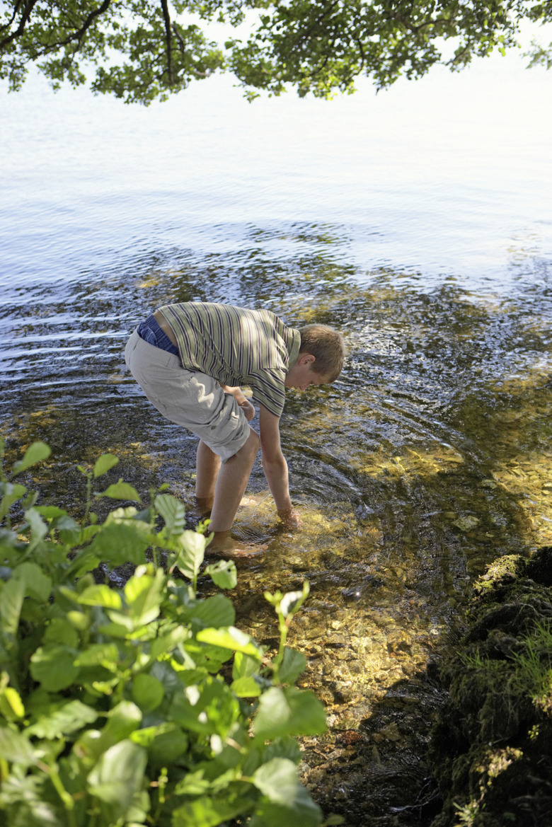 Teenage boy (13-15) in lake